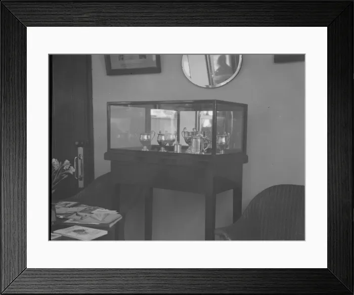 Framed Print : Cabinet containing motor racing trophies. Artist: Bill Brunell Framed Print : Cabinet containing motor racing trophies. Artist: Bill Brunell