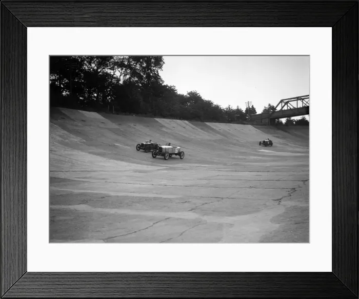 Framed Print : Alvis 17 and Austin 747 cc racing on the banking at Brooklands. Artist: Bill Brunell Framed Print : Alvis 17 and Austin 747 cc racing on the banking at Brooklands. Artist: Bill Brunell