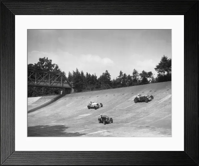 Framed Print : Lea-Francis 1496 cc, MG M type and Invicta 4467 cc racing on the Members Banking at Brooklands Framed Print : Lea-Francis 1496 cc, MG M type and Invicta 4467 cc racing on the Members Banking at Brooklands