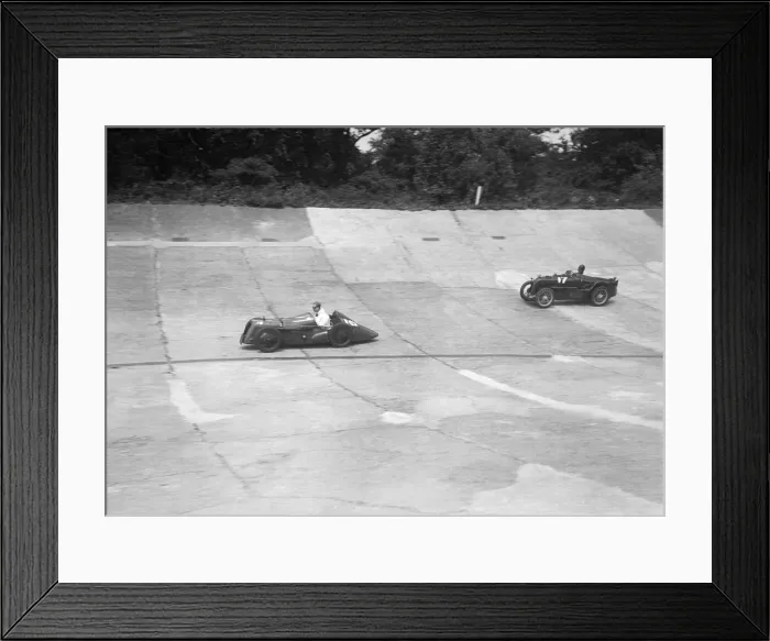 Framed Print : Austin 747 cc with sreamlined racing body leading an MG C type on the Members Banking at Brooklands Framed Print : Austin 747 cc with sreamlined racing body leading an MG C type on the Members Banking at Brooklands