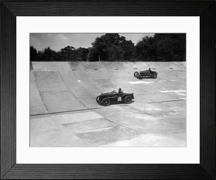 Framed Print : MG C type and Amilcar C6 racing on the banking at Brooklands. Artist: Bill Brunell Framed Print : MG C type and Amilcar C6 racing on the banking at Brooklands. Artist: Bill Brunell