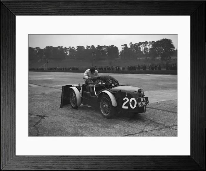 Framed Print : Mechanic making adjustments to a MG C type, Brooklands. Artist: Bill Brunell Framed Print : Mechanic making adjustments to a MG C type, Brooklands. Artist: Bill Brunell