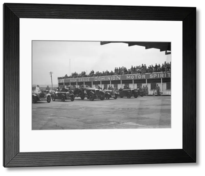 Framed Print : Cars at the start of a race at a JCC Meeting, Brooklands. Artist: Bill Brunell Framed Print : Cars at the start of a race at a JCC Meeting, Brooklands. Artist: Bill Brunell