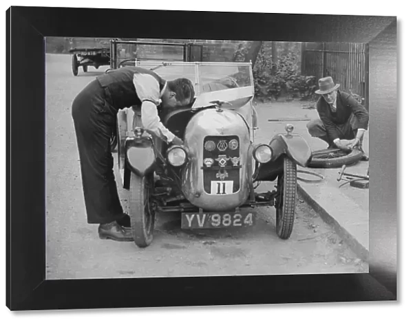 Working on the engine of E Martins Austin Swallow at the North West London Motor Club Trial, 1929