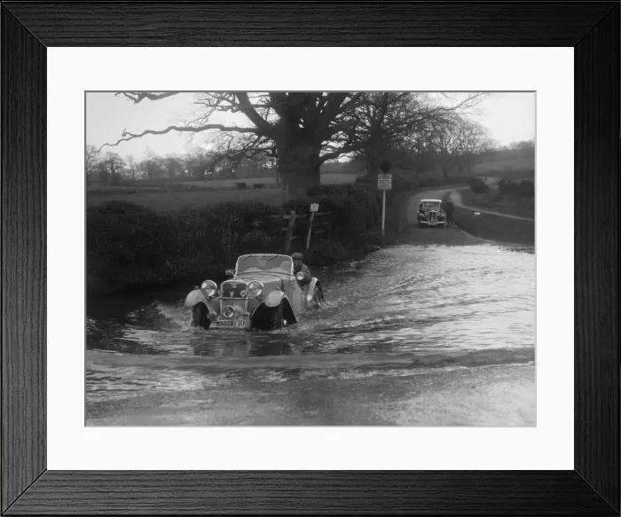 Framed Print : 972 cc Singer Le Mans driving through a ford during a motoring trial, 1936. Artist: Bill Brunell Framed Print : 972 cc Singer Le Mans driving through a ford during a motoring trial, 1936. Artist: Bill Brunell