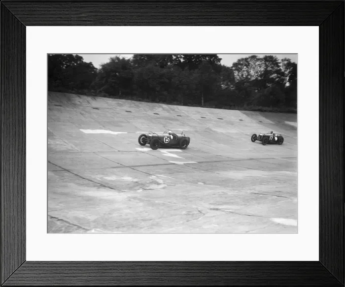 Framed Print : Two Riley 9 Brooklands racing on the banking at a JCC Members Day, Brooklands. Artist: Bill Brunell Framed Print : Two Riley 9 Brooklands racing on the banking at a JCC Members Day, Brooklands. Artist: Bill Brunell