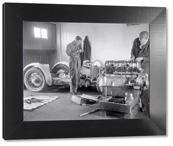 Mechanics working on Raymond Mays 4500 cc Invicta car. Artist: Bill Brunell