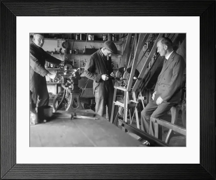 Framed Print : Geoffrey Baker with two other men in a workshop. Artist: Bill Brunell Framed Print : Geoffrey Baker with two other men in a workshop. Artist: Bill Brunell