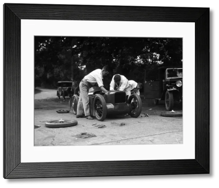 Framed Print : Mechanics working on Leon Cushmans Austin 7 racer for a speed record attempt, Brooklands, 1931 Framed Print : Mechanics working on Leon Cushmans Austin 7 racer for a speed record attempt, Brooklands, 1931