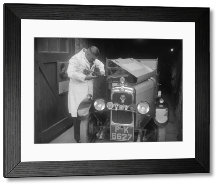 Framed Print : FA Thatcher working on his 1929 Triumph Super Seven. Artist: Bill Brunell