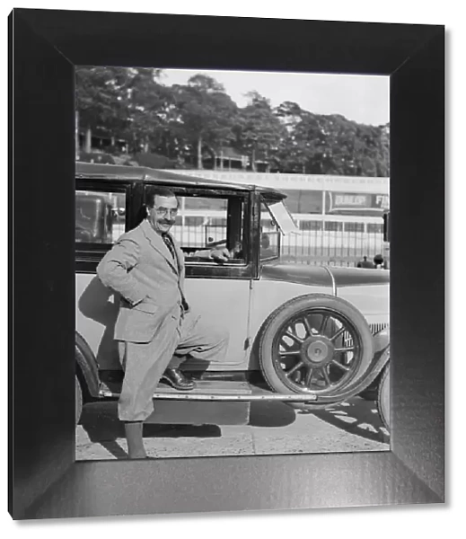 Hugh McConell beside a car, Brooklands, 3 August 1931. Artist: Bill Brunell