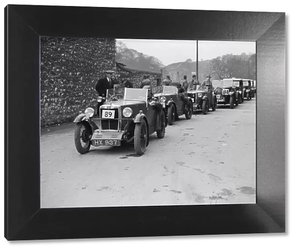 MG M type of EG Farrow at the head of a line of cars competing in the MCC Sporting Trial, 1930