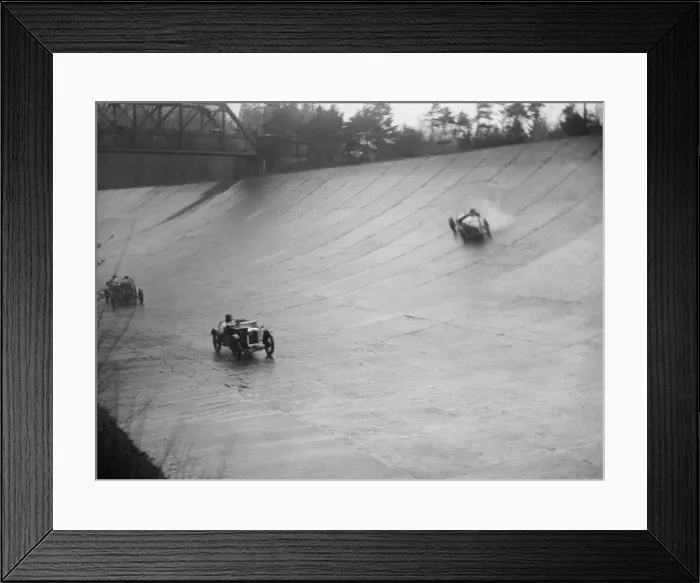 Framed Print : Austin 7 and the spinning Riley of HL Roberts, BARC Mountain Race, Brooklands, Surrey Framed Print : Austin 7 and the spinning Riley of HL Roberts, BARC Mountain Race, Brooklands, Surrey