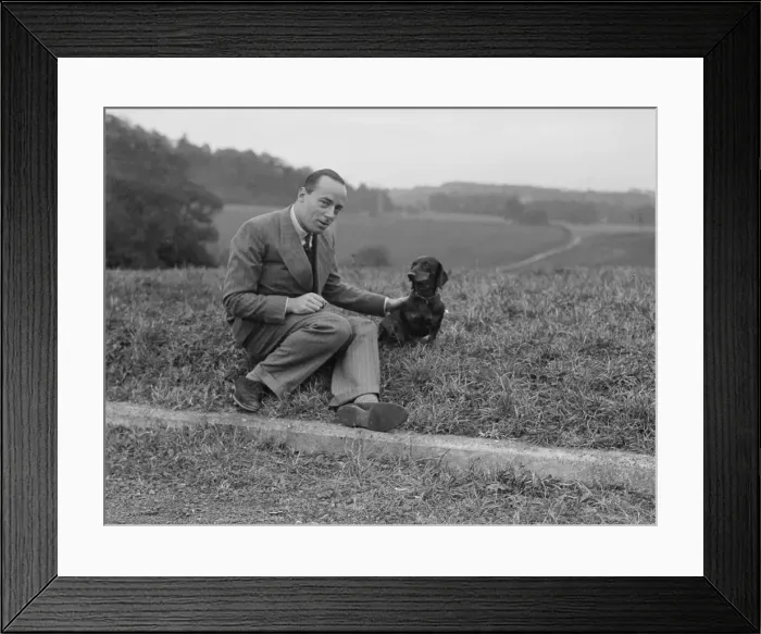 Framed Print : British racing driver Charles Mortimer and his pet dachshund, c1930s Artist: Bill Brunell Framed Print : British racing driver Charles Mortimer and his pet dachshund, c1930s Artist: Bill Brunell