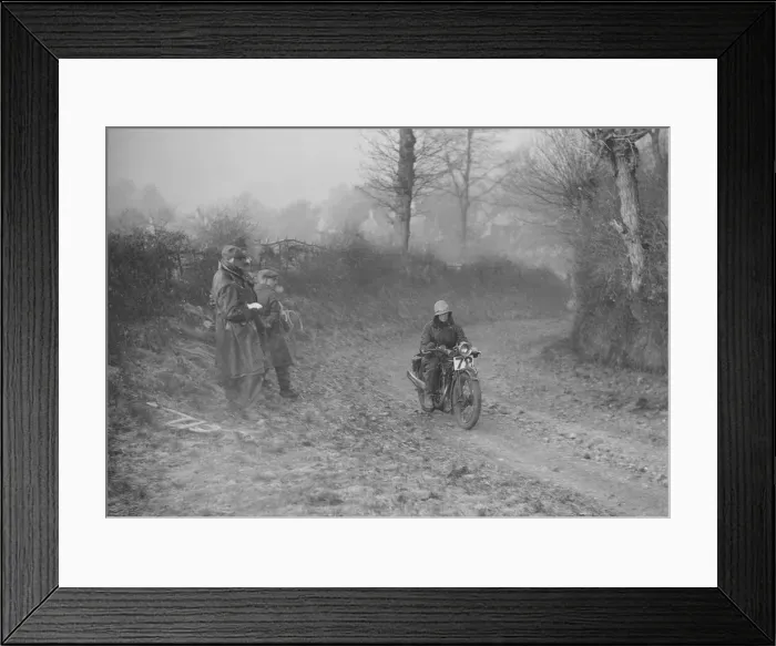 Framed Print : Woman riding a Royal Enfield motorcycle in the Gloucester Trial, c1930s. Artist: Bill Brunell Framed Print : Woman riding a Royal Enfield motorcycle in the Gloucester Trial, c1930s. Artist: Bill Brunell