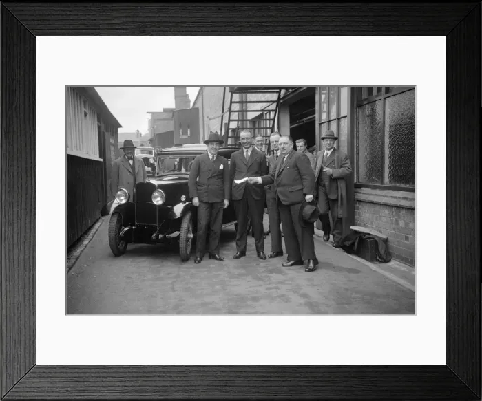Framed Print : Group of men with a Triumph Super Seven, c1930(?). Artist: Bill Brunell Framed Print : Group of men with a Triumph Super Seven, c1930(?). Artist: Bill Brunell