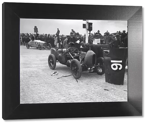 Leon Cushman working on his Bugatti Brescia at the JCC 200 Mile Race, Brooklands, Surrey, 1922