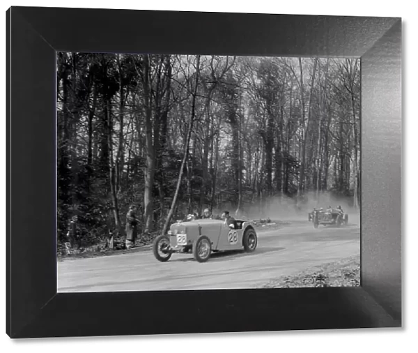Singer of JR Baker leading a Riley at Coppice Corner, Donington Park, Leicestershire, 1933