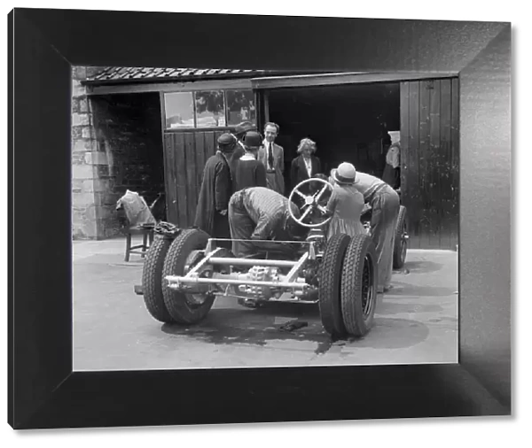 Working on Raymond Mays Vauxhall-Villiers, c1930s. Artist: Bill Brunell