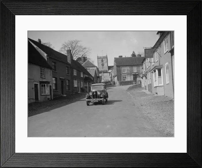 Framed Print : Standard Sixteen saloon driving down the High Street, Hambledon, Hampshire, 1930s Framed Print : Standard Sixteen saloon driving down the High Street, Hambledon, Hampshire, 1930s