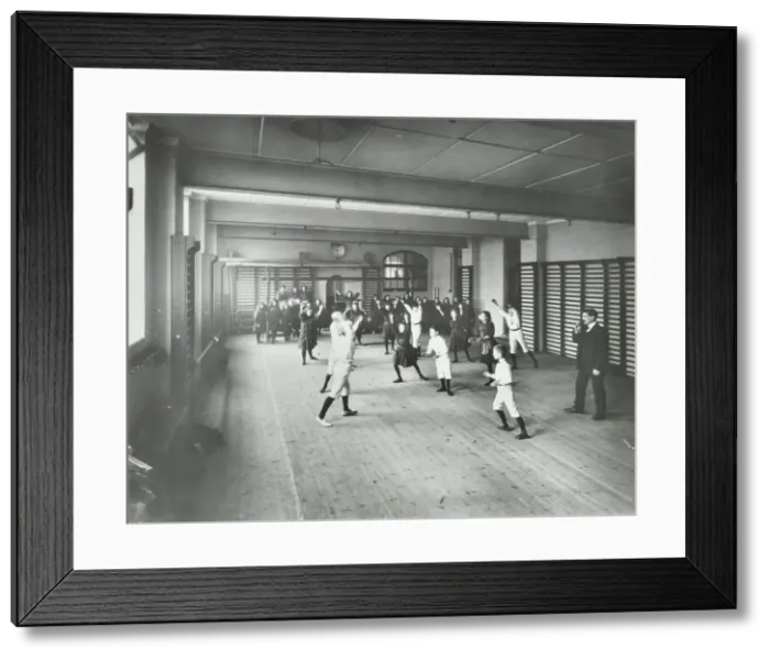 Framed Print : Boys and girls playing netball, Cable Street School, Stepney, London, 1908 Framed Print : Boys and girls playing netball, Cable Street School, Stepney, London, 1908