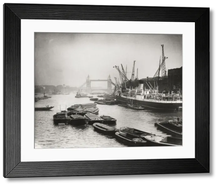 Framed Print : View of the busy Thames looking towards Tower Bridge, London, c1920 Framed Print : View of the busy Thames looking towards Tower Bridge, London, c1920