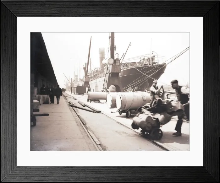 Framed Print : Unloading rolls of paper from a ship, London, c1905 Framed Print : Unloading rolls of paper from a ship, London, c1905