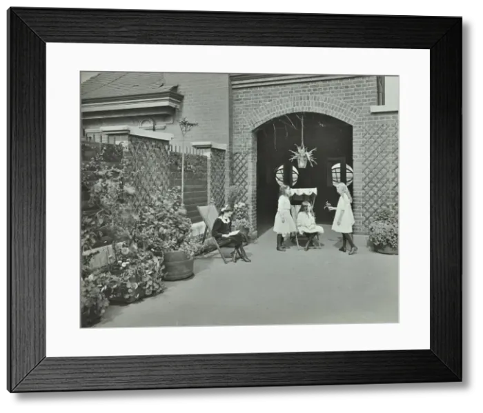 Framed Print : Girls relaxing in a roof top garden, White Lion Street School, London, 1912 Framed Print : Girls relaxing in a roof top garden, White Lion Street School, London, 1912