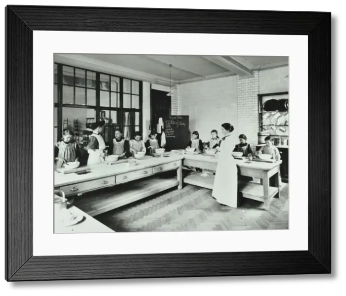 Framed Print : Student teacher in a cookery lesson, Battersea Polytechnic, London, 1907 Framed Print : Student teacher in a cookery lesson, Battersea Polytechnic, London, 1907