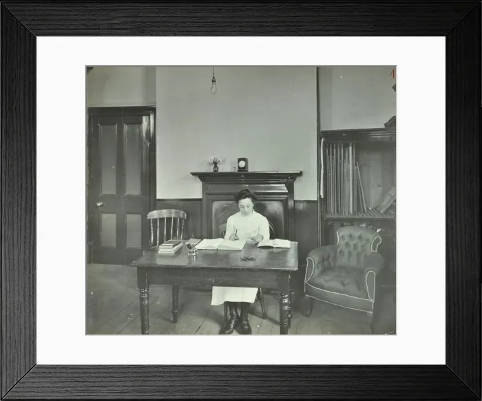 Framed Print : Female student sitting at desk, Shoreditch Technical Institute, London, 1907 Framed Print : Female student sitting at desk, Shoreditch Technical Institute, London, 1907