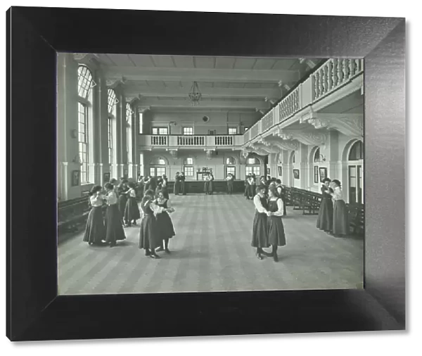 Girls dancing in the assembly hall, Clapham Secondary School, London, 1910