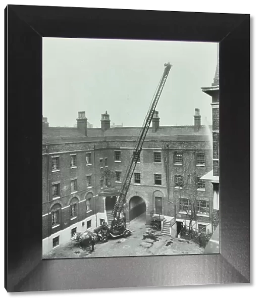 Firemen demonstrating the magirus ladder, London Fire Brigade Headquarters, London, 1910