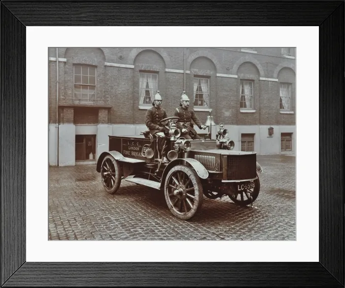 Framed Print : Firemen in brass helmets aboard a motor hose tender, London Fire Brigade Headquarters, London, 1909 Framed Print : Firemen in brass helmets aboard a motor hose tender, London Fire Brigade Headquarters, London, 1909