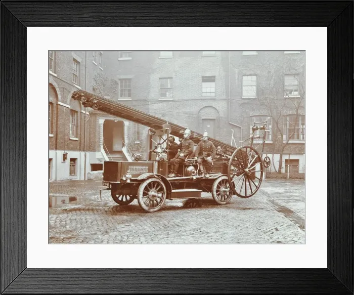 Framed Print : Firemen aboard a motor fire escape vehicle, London Fire Brigade Headquarters, London, 1909 Framed Print : Firemen aboard a motor fire escape vehicle, London Fire Brigade Headquarters, London, 1909