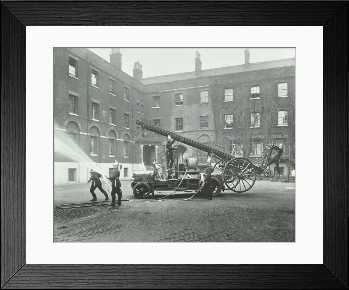 Framed Print : Fireman using a hose, London Fire Brigade Headquarters, London, 1910 Framed Print : Fireman using a hose, London Fire Brigade Headquarters, London, 1910