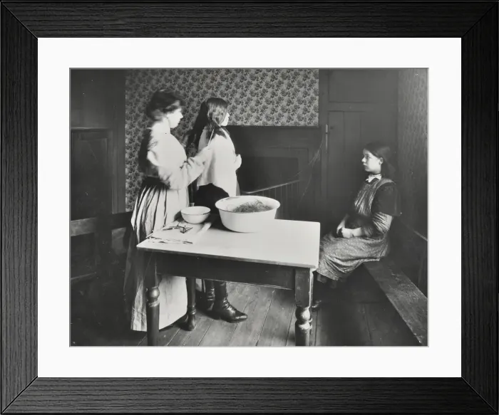 Framed Print : A nurse examines girls hair, Central Street Cleansing Station, London, 1914 Framed Print : A nurse examines girls hair, Central Street Cleansing Station, London, 1914