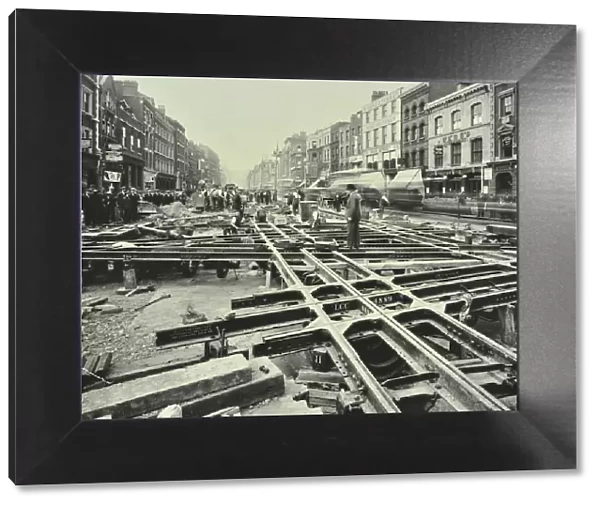 Men laying tramlines at a junction, Whitechapel High Street, London, 1929