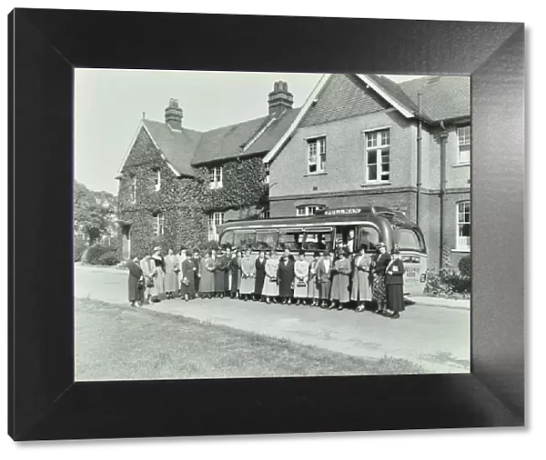 Group of women visitors in front of a school, Croydon, 1937