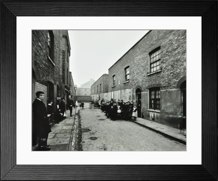 Framed Print : People outside boarded-up houses in Ainstey Street, Bermondsey, London, 1903 Framed Print : People outside boarded-up houses in Ainstey Street, Bermondsey, London, 1903