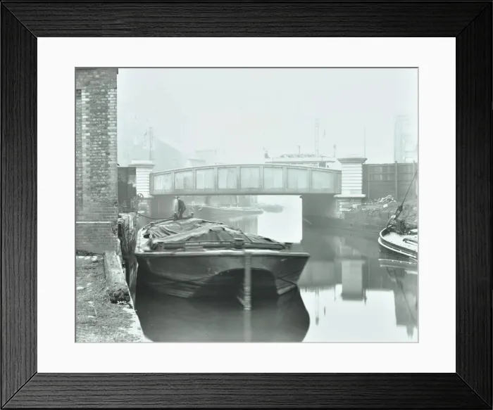 Framed Print : Man mooring a barge by a river bank, Poplar, London, 1905 Framed Print : Man mooring a barge by a river bank, Poplar, London, 1905