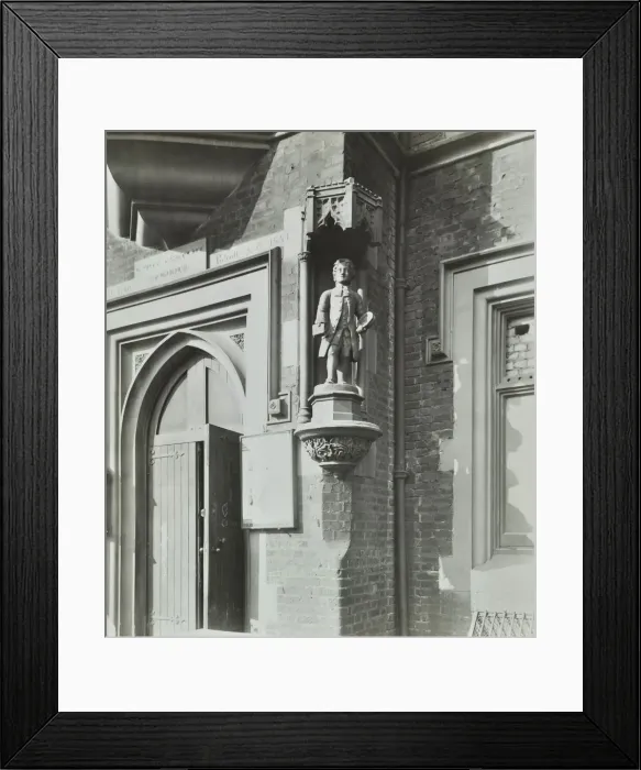 Framed Print : Statue of a boy scholar beside the door, Hamlet of Ratcliff Schools, Stepney, London, 1945 Framed Print : Statue of a boy scholar beside the door, Hamlet of Ratcliff Schools, Stepney, London, 1945