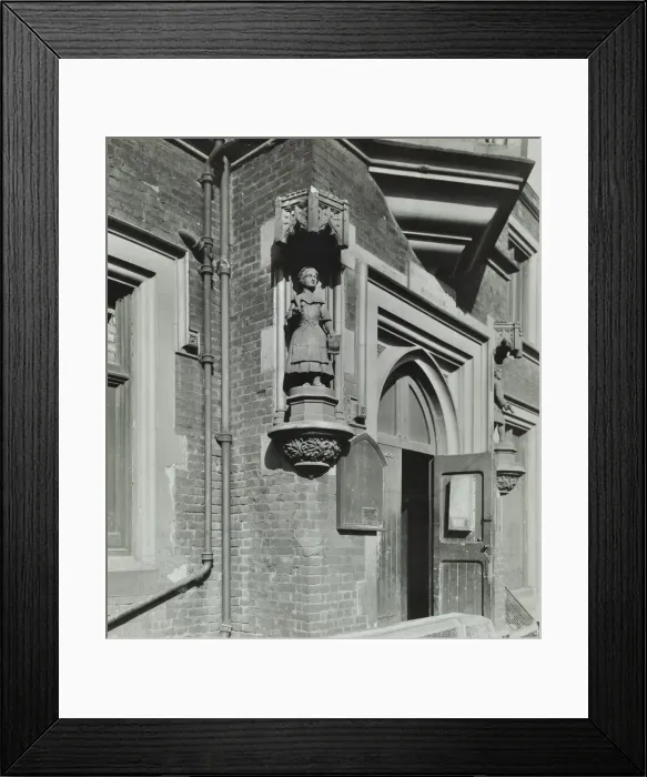 Framed Print : Statue of a girl scholar beside the door, Hamlet of Ratcliff Schools, Stepney, London, 1945 Framed Print : Statue of a girl scholar beside the door, Hamlet of Ratcliff Schools, Stepney, London, 1945