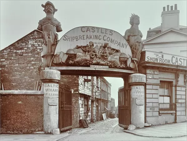 Ships figureheads over the gate at Castles Shipbreaking Yard, Westminster, London, 1909