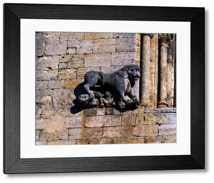 Framed Print : Church of San Pedro de Besalu, lion protecting a human figure and decorating Framed Print : Church of San Pedro de Besalu, lion protecting a human figure and decorating