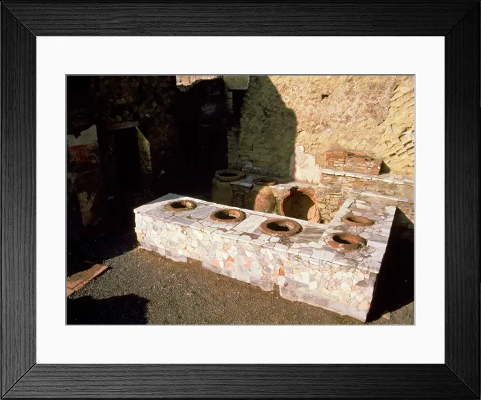 Framed Print : Termopolio ruins, hot food shop, located on Cardo V street, located on the ruins of Herculaneum Framed Print : Termopolio ruins, hot food shop, located on Cardo V street, located on the ruins of Herculaneum
