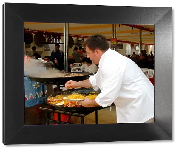 Mediterranean cuisine, chef preparing a paella, Feria de Abril (April Fair) 2002