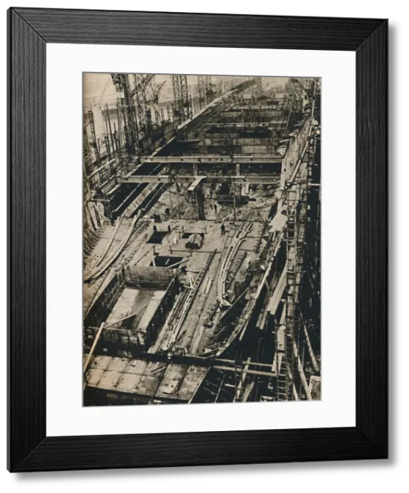 Framed Print : More than 1, 000 Feet Long. Shell of Queen Mary in early days of construction, 1930-1934, (1936) Framed Print : More than 1, 000 Feet Long. Shell of Queen Mary in early days of construction, 1930-1934, (1936)