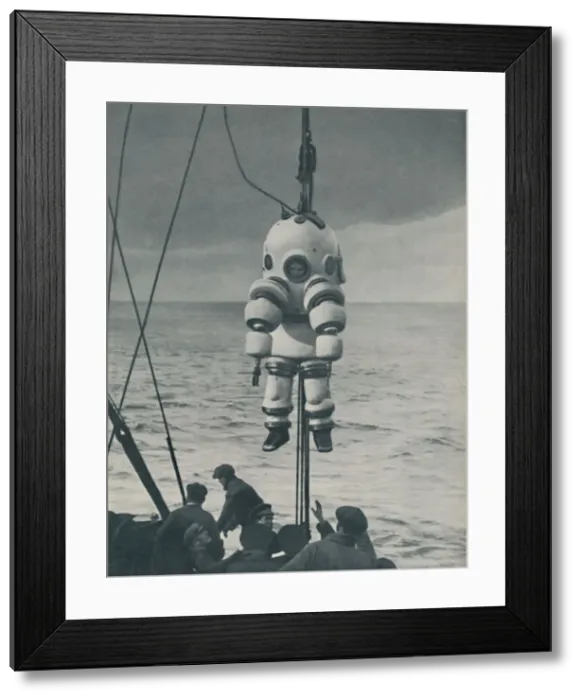 Framed Print : The Eternal Fight Against the Sea: Armoured Casing for the Deep-Sea Diver, c1935 Framed Print : The Eternal Fight Against the Sea: Armoured Casing for the Deep-Sea Diver, c1935