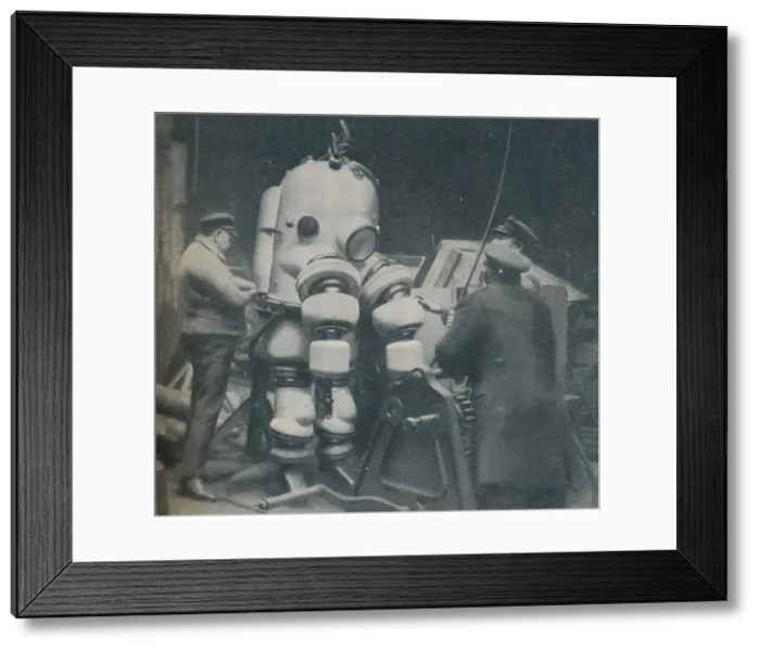 Framed Print : Going Down at Short Notice: A British Diver Preparing To Seek a Submarine at Sea Bottom, c1935 Framed Print : Going Down at Short Notice: A British Diver Preparing To Seek a Submarine at Sea Bottom, c1935