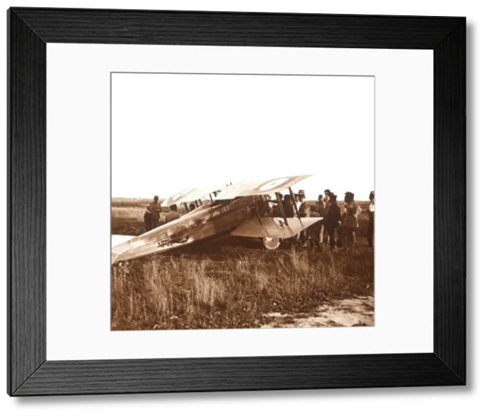 Framed Print : Soldiers surrounding biplane, Somme, northern France, c1914-c1918 Framed Print : Soldiers surrounding biplane, Somme, northern France, c1914-c1918